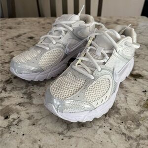 Nike Woman’s White and Silver Mesh Running Sneakers